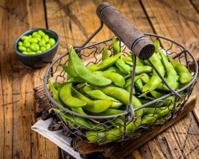 Edamame green Beans, fresh soy beans. Wooden background. Top view