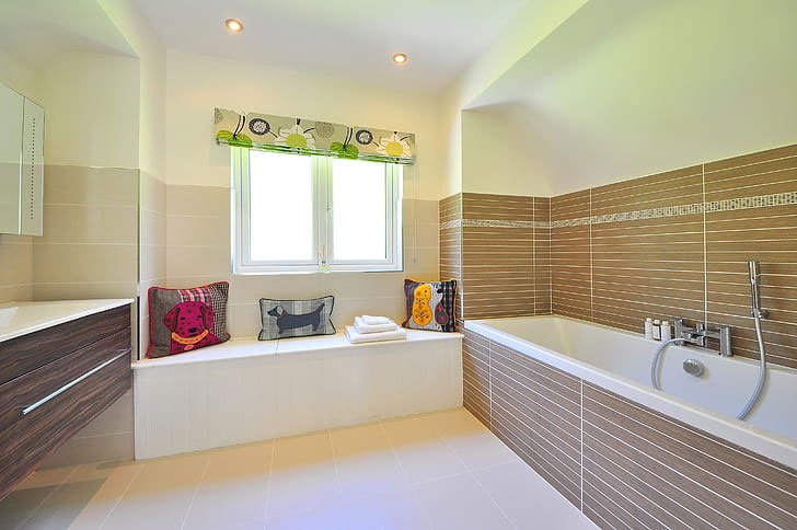 white and brown bathtub